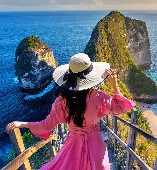 a lady in pink dress at the top