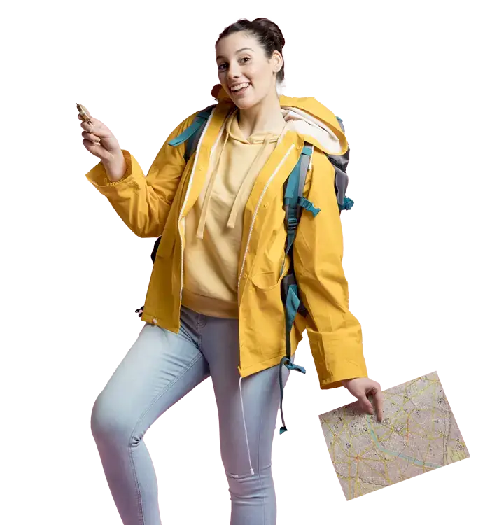 Person in yellow jacket and backpack holding a smartphone and map.