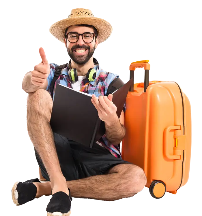 a happy young travevver with a hat, diary and trolley bag gives a thumps up