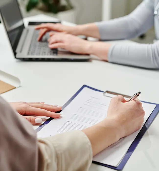 travel agent fills visa application form